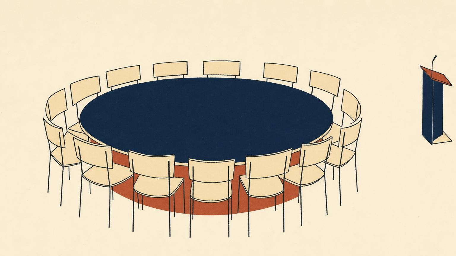 A small lectern pushed to the edge of the frame beside a large round table surrounded by chairs at the center